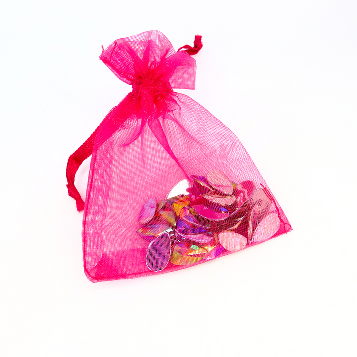 Rosa festival face gems by Luminosity Glitter come in an iridescent pink shade and a cute little hot pink organza bag to keep them safe after use