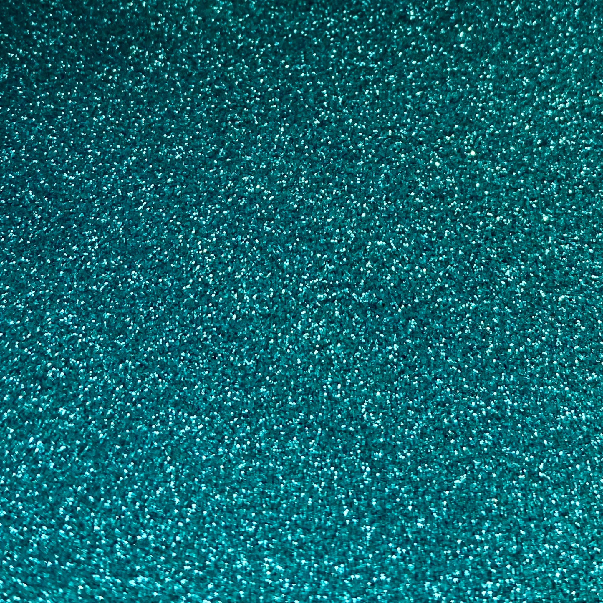 Fine turquoise biodegradable glitter close up. Perfect for glitter nail art.
