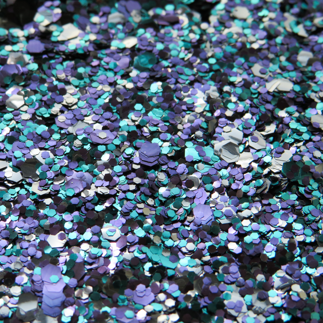 A close up of Winter Wonderland by Luminosity Glitter. Fine, chunky and ultra chunky eco glitter in turquoise, violet and silver.