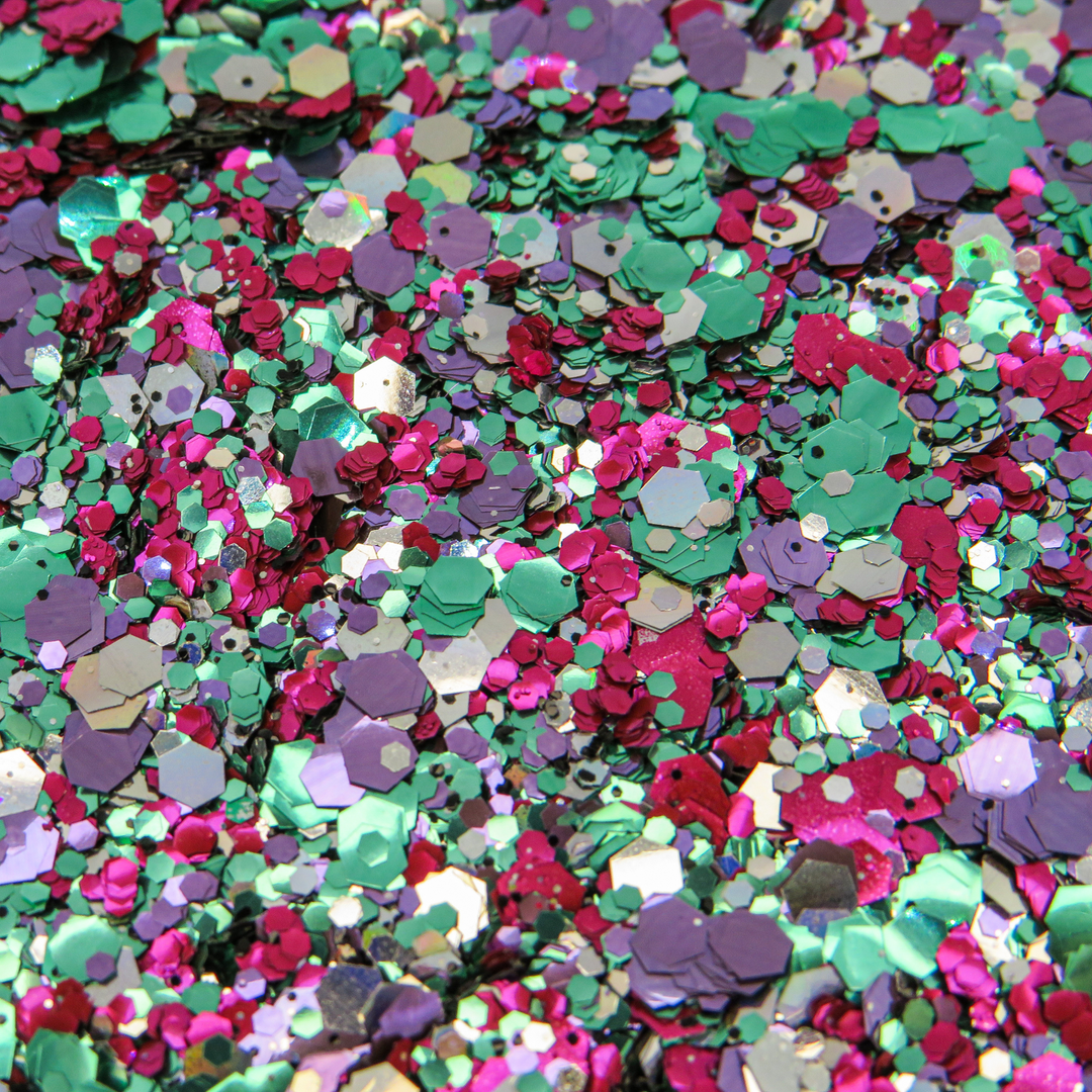 Witches Brew eco glitter by Luminosity Glitter based in London. A stunning mix of magenta, green, purple, holographic and jet black biodegradable glitter.